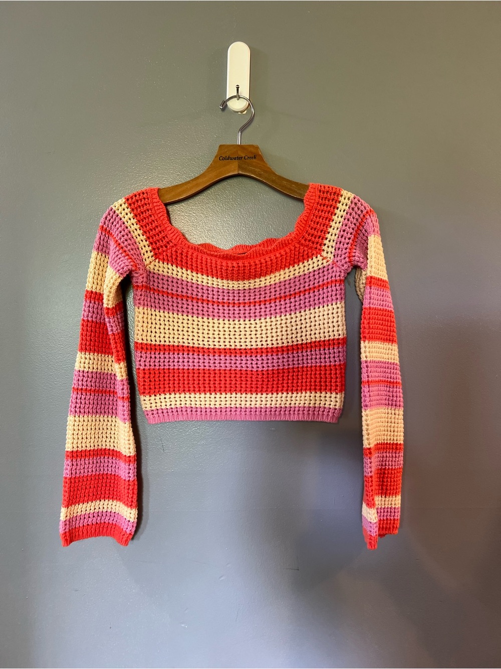 Aqua Blues women's long sleeve top features a vibrant crochet knit design